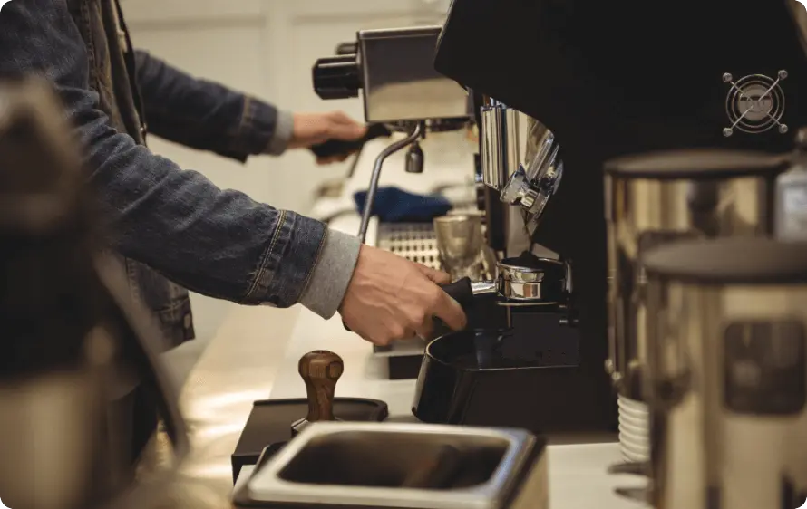 Man repairing a coffee machine