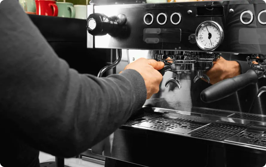 Man repairing a coffee machine