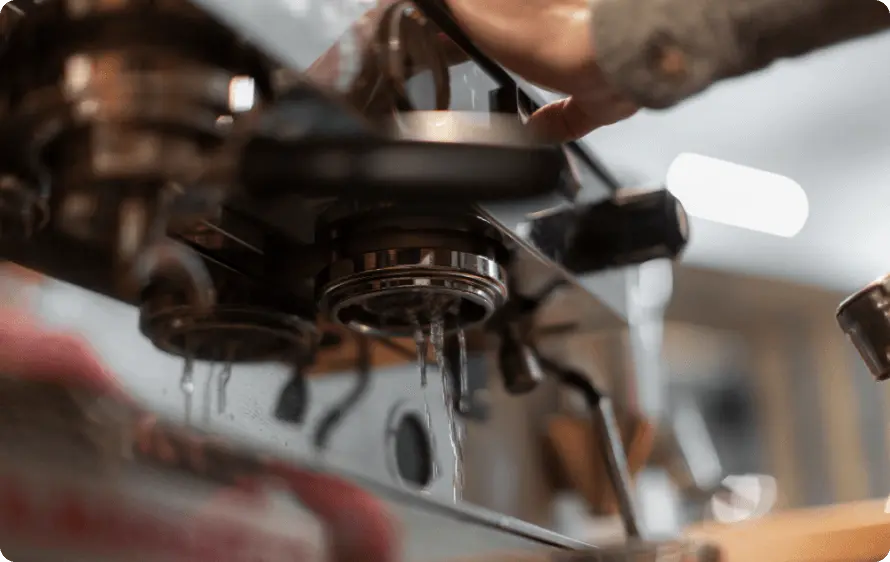 Man repairing a coffee machine